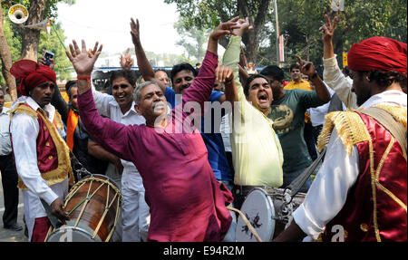 New Delhi. 19th Oct, 2014. Bharatiya Janata Party (BJP) supporters celebrate outside the BJP headquarters as Haryana and Maharashtra states assembly elections results come out in New Delhi, India on Oct.19, 2014. India's ruling BJP has won control of the country's financial capital Mumbai through a legislative election in the state of Maharashtra, while also grasping the northern state of Haryana from the Congress, said vote counting results Sunday. Credit:  Partha Sarkar/Xinhua/Alamy Live News Stock Photo