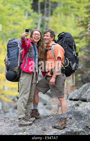 Backpackers taking self portraits in Oregon's Wallowa Mountains. Stock Photo