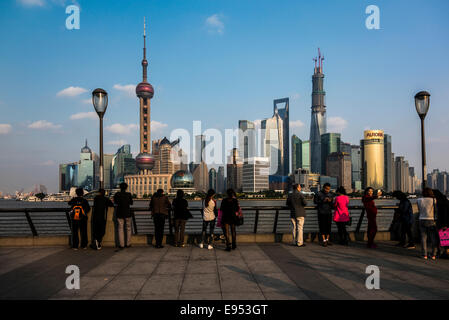 Tourists in front of the Pudong skyline with Oriental Pearl Tower, Shanghai World Financial Center and Shanghai Tower Stock Photo