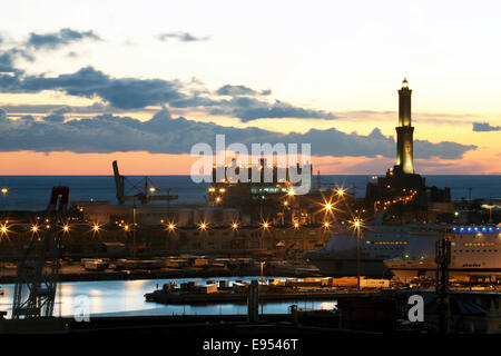 The Lighthouse of Genoa with cruise ship in the Porto Antico harbour, Genoa, Liguria, Italy Stock Photo