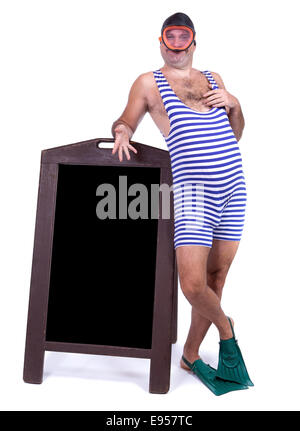 Man in swimsuit standing beside menu Stock Photo