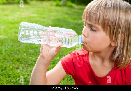 Little Girl Drinking Mineral Water Bottle Stock Photo 85221286