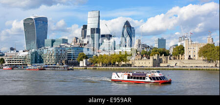 Thames tour boat & London skyscraper skyline landmarks L to R Walkie Talkie Cheesegrater & Gherkin dwarf riverside historic ancient Tower of London UK Stock Photo