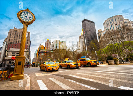 NEW YORK - JULY 21: Yellow taxis on 5th Avenue on July 21 2012 in New York, USA. 5th Avenue is a central road of Manhattan, the  Stock Photo