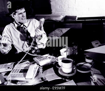 Stressed office worker Stock Photo