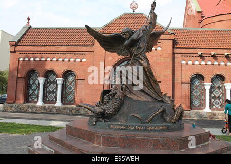bronze statue of Archangel Michael kill  spike twisted serpent Stock Photo