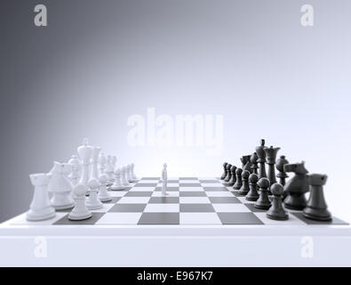 Tiny figurine on a chess board Stock Photo