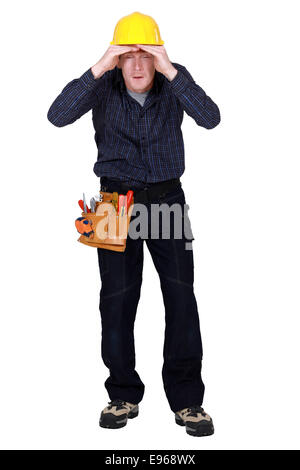 Construction worker peering into the distance Stock Photo