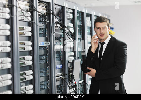 young it engeneer in datacenter server room Stock Photo