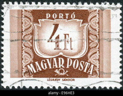 HUNGARY - CIRCA 1969: Postage stamp (dues) printed in Hungary, shows a figure - value on the heraldic coat of arms, circa 1969 Stock Photo