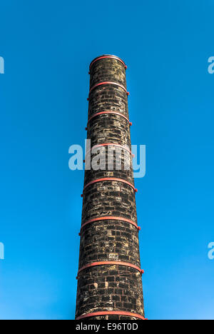 Old Mill chimney with metals bands along the Rochdale canal near Hebden Bridge, West Yorkshire. Stock Photo