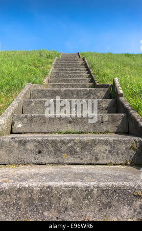 Old concrete steps leading to the top of a hill. Stock Photo