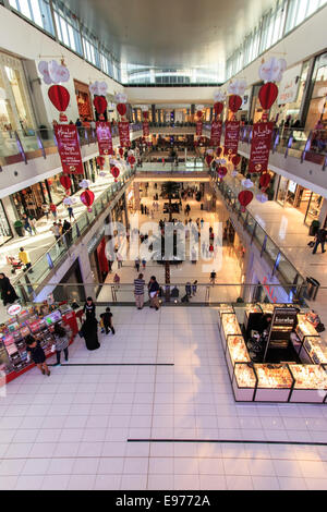 DUBAI, UAE - October 07, 2014: Shoppers at Dubai Mall in Dubai, United Arab Emirates. Dubai Mall is one of the largest mall in t Stock Photo