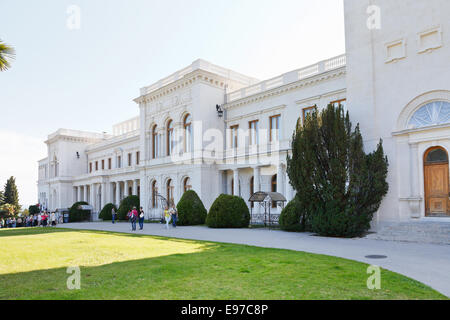 YALTA, RUSSIA - SEPTEMBER 28, 2014: people near Grand Livadia Palace in Crimea. Livadia estate was summer residence of the Russi Stock Photo