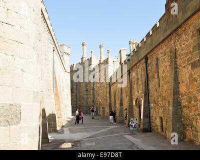 ALUPKA, RUSSIA - SEPTEMBER 28, 2014: tourists in Shuvalov Passage of Vorontsov (Alupka) Palace in Crimea. The palace was built i Stock Photo