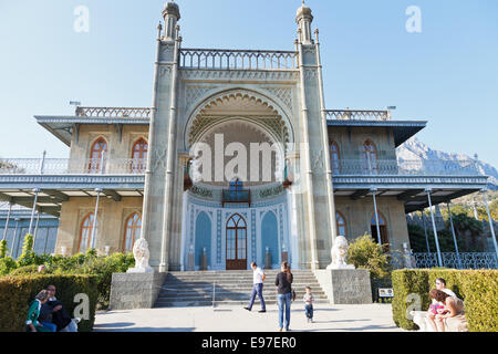 ALUPKA, RUSSIA - SEPTEMBER 28, 2014: people near south entrance facade of Vorontsov (Alupka) Palace in Crimea. The palace was bu Stock Photo