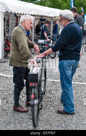 Presteigne, Powys, UK. Interested visitors at a demonstration of electric bikes Stock Photo