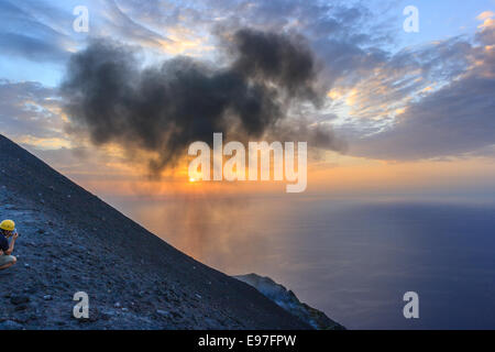 Taking picture of a volcanic eruption in Stromboli Stock Photo
