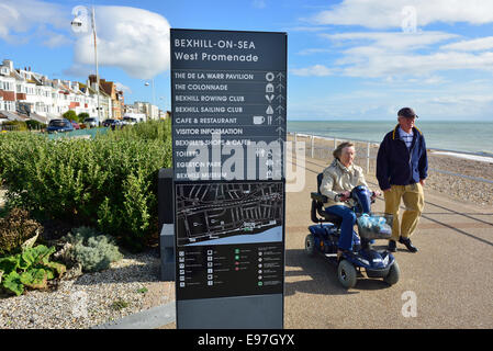 An elderly couple strolling along Bexhill on Sea promenade. East Sussex Stock Photo