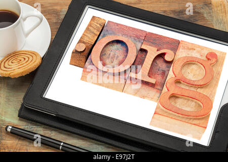 dot org internet domain for non-profit organization in letterpress wood type printing blocks on a digital tablet scree Stock Photo