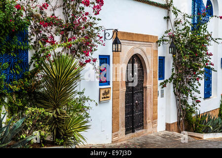 A typical studded wooden door and whitewashed house in Sidi Bou Said, Tunisia. Stock Photo