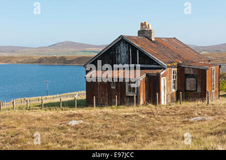 A rusted corrugated iron building on the Isle of Lewis in the Outer Hebrides. Stock Photo