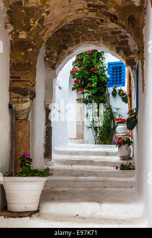 Narrow arched alleyway in Sidi Bou Said, Tunisia.