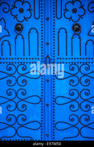 Close-up of a typical blue, studded wooden door in Sidi Bou Said, Tunisia. Stock Photo
