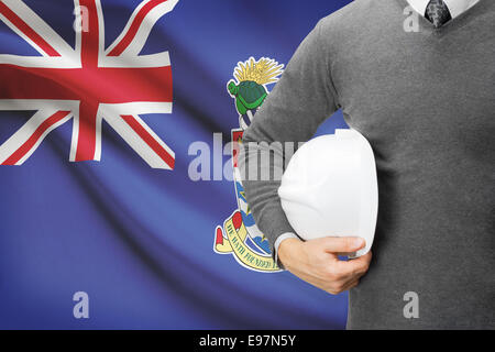 Engineer with flag on background - Cayman Islands Stock Photo