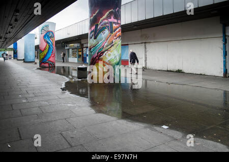 Colourful graffiti used in an attempt to cheer up an ugly run down ...