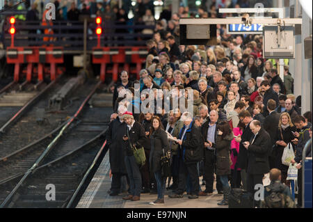 Manchester, UK.  21st October, 2014. The remnants of Hurricane Gonzalo caused considerable travel disruption to rail commuters across the United Kingdom, including those at Manchester Piccadilly. Some rail operators advised passengers to check services before setting off. Credit:  Russell Hart/Alamy Live News. Stock Photo