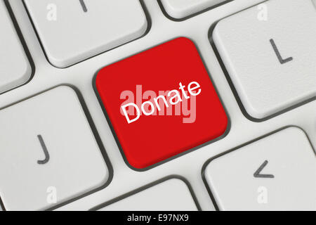 Red donate button on the keyboard close-up Stock Photo