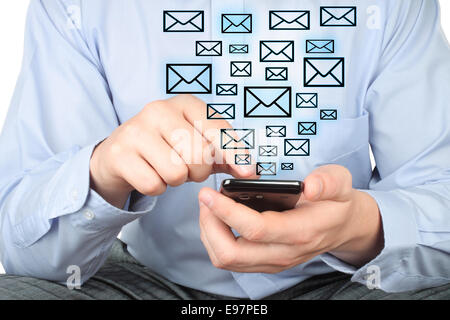 Businessman uses smart phone with virtual envelopes on white background Stock Photo