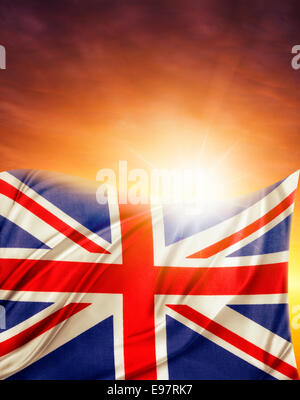 Union Jack flag in front of bright sky Stock Photo