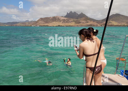 Mauritius travel; Tourists snorkelling in Mauritius, Indian ocean, Africa Stock Photo