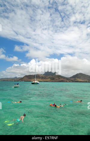 Mauritius tourism; Tourists snorkelling in Mauritius, Africa Stock Photo