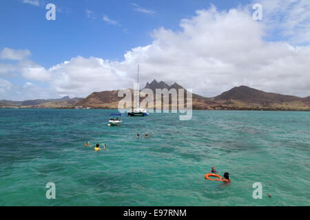 Tourists snorkelling in Mauritius, Indian Ocean, Africa Stock Photo