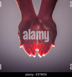 embryo silhouette in woman hand Stock Photo