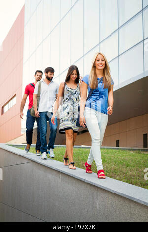 Group of university students walking in a row Stock Photo