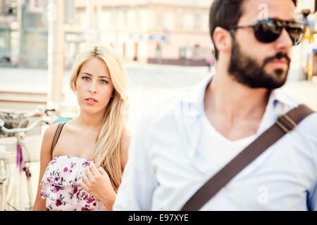 Portrait of young couple sightseeing in town Stock Photo