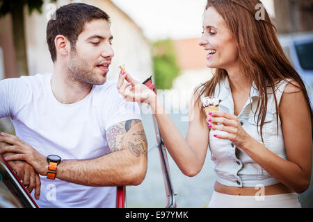 Young couple eating ice cream together Stock Photo