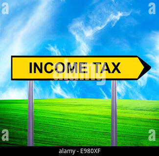 Conceptual arrow sign against beautiful landscape with text - INCOME TAX Stock Photo