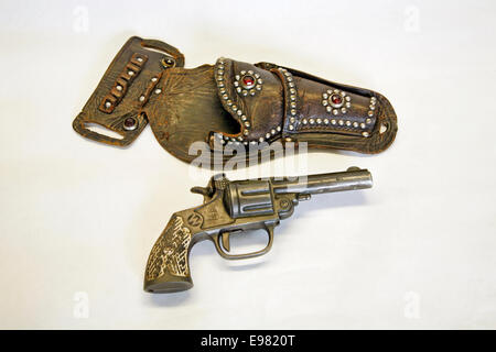 An antique cap pistol and leather holster circa 1900 Stock Photo