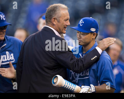 Former Kansas City Royals George Brett (C) stands near the batting cage  watching warm ups before the San Francisco Giants-Kansas City Royals game 1  of the World Series at Kaufman Stadium in