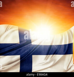 Finnish flag in front of bright sky Stock Photo