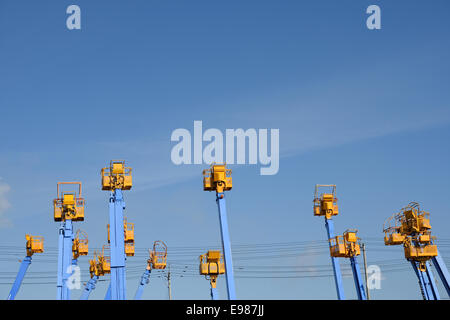Cherry picker platform against a blue sky Stock Photo