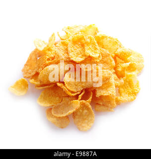 Small sampling of corn flake cereal in a pile isolated against a white background Stock Photo