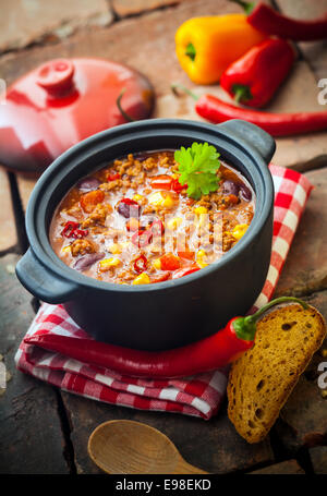 Tasty spicy chili con carne casserole in a pot for those cold winter nights, high angle view Stock Photo