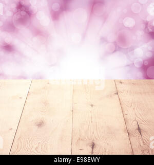 Empty wooden board with blurry pink bokeh background and an oak table or plate with copy space Stock Photo