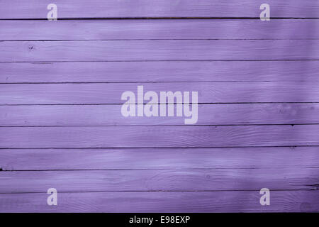 Wooden background texture in a 2014 fashion color of a pretty shade of lilac or purple with parallel horizontal boards or cladding Stock Photo